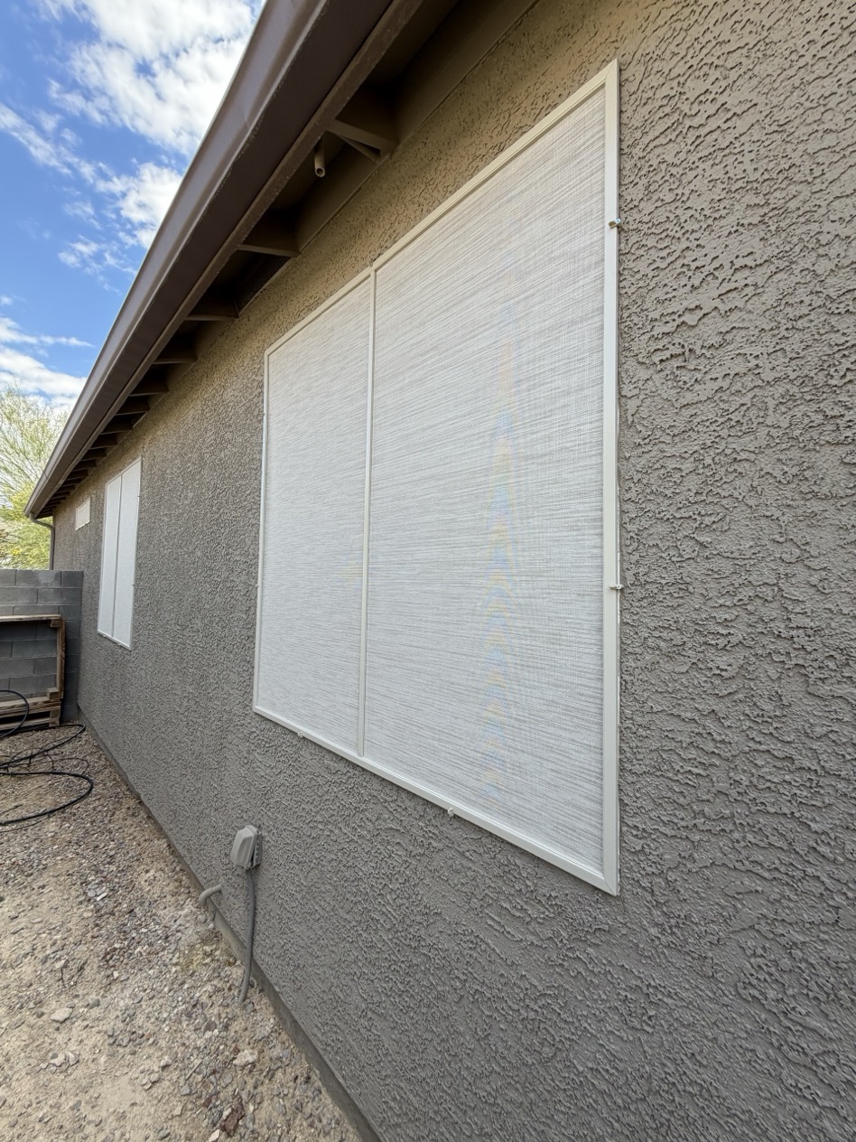 Centennial Hills Las Vegas stucco home with custom solar screens installed across multiple windows