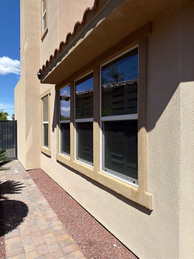 Custom window screens installed on a Spring Valley Las Vegas stucco home with fiberglass mesh
