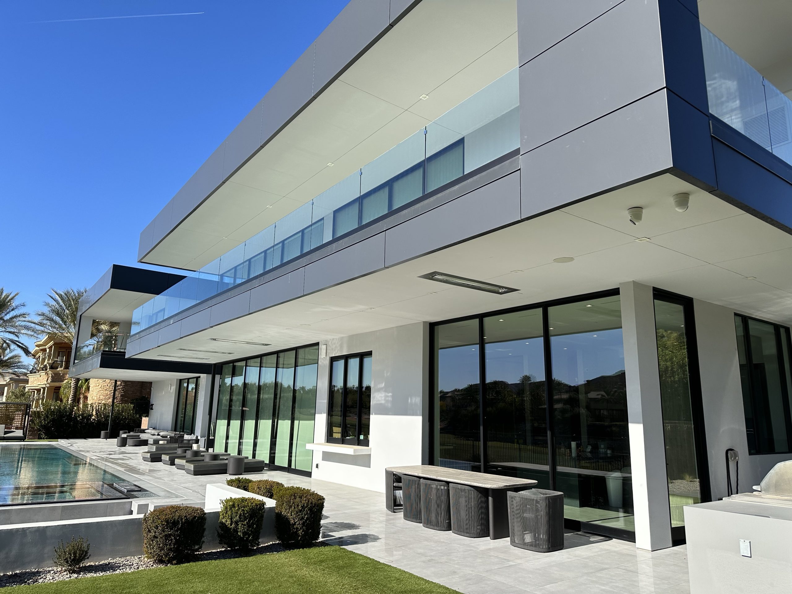 Professional window cleaning on a large Henderson estate home with expansive glass surfaces